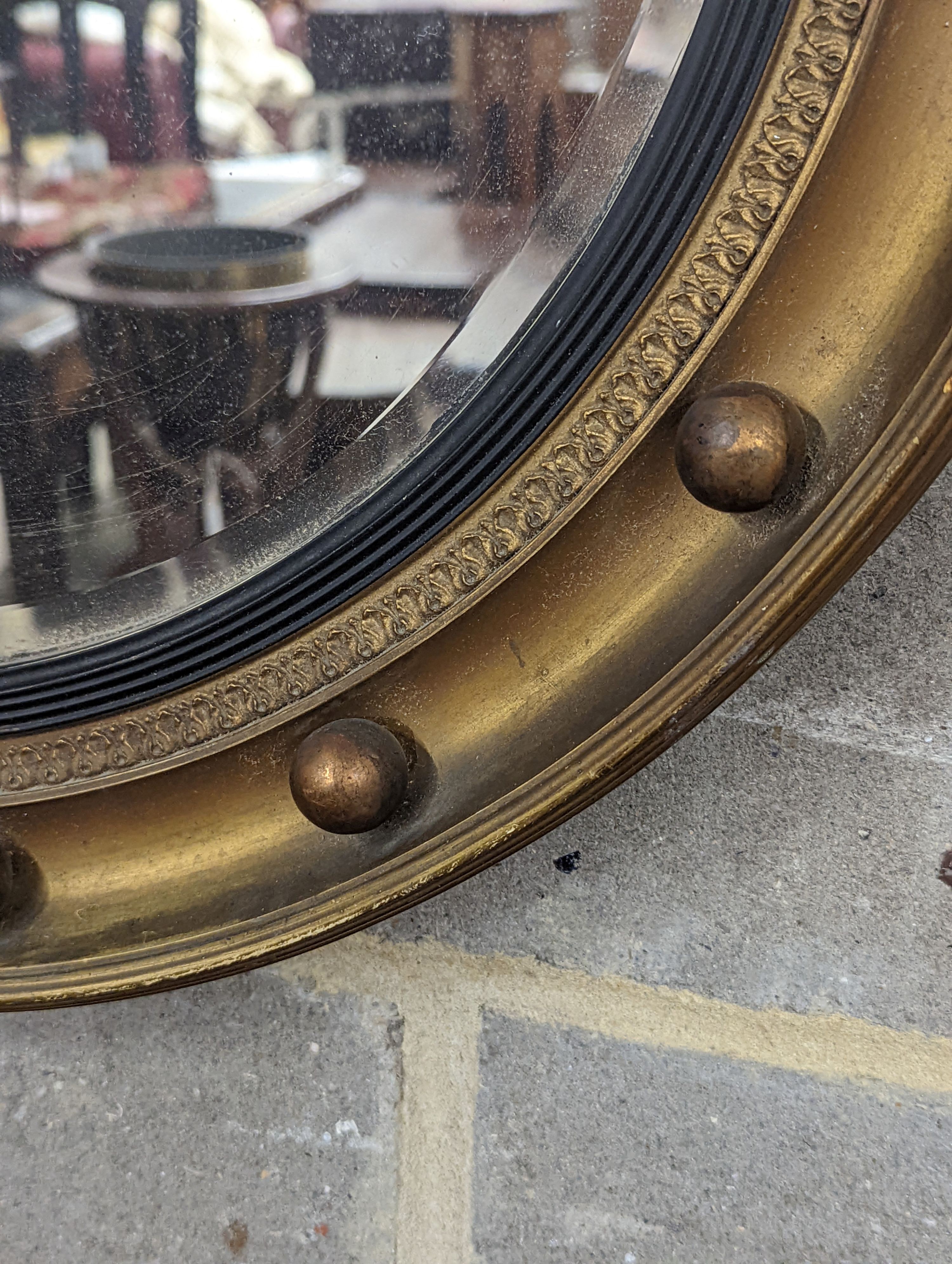 A Regency style circular gilt framed wall mirror, diameter 59cm